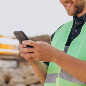 Male worker with bulldozer in sand quarry